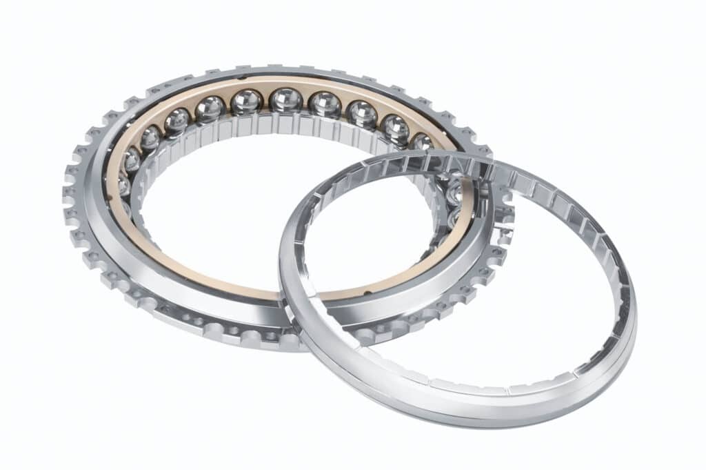 Cylindrical bearing has been taken apart in two pieces and laid out for display