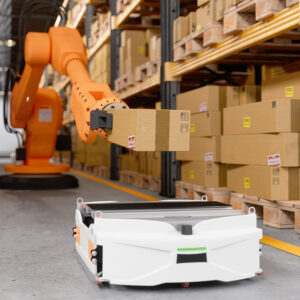 A warehouse robotic arm moving a box off a shelf.