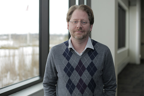 Photograph of Dr. Bill Hannon, Timken Manager, Product R&D, standing next to a window.