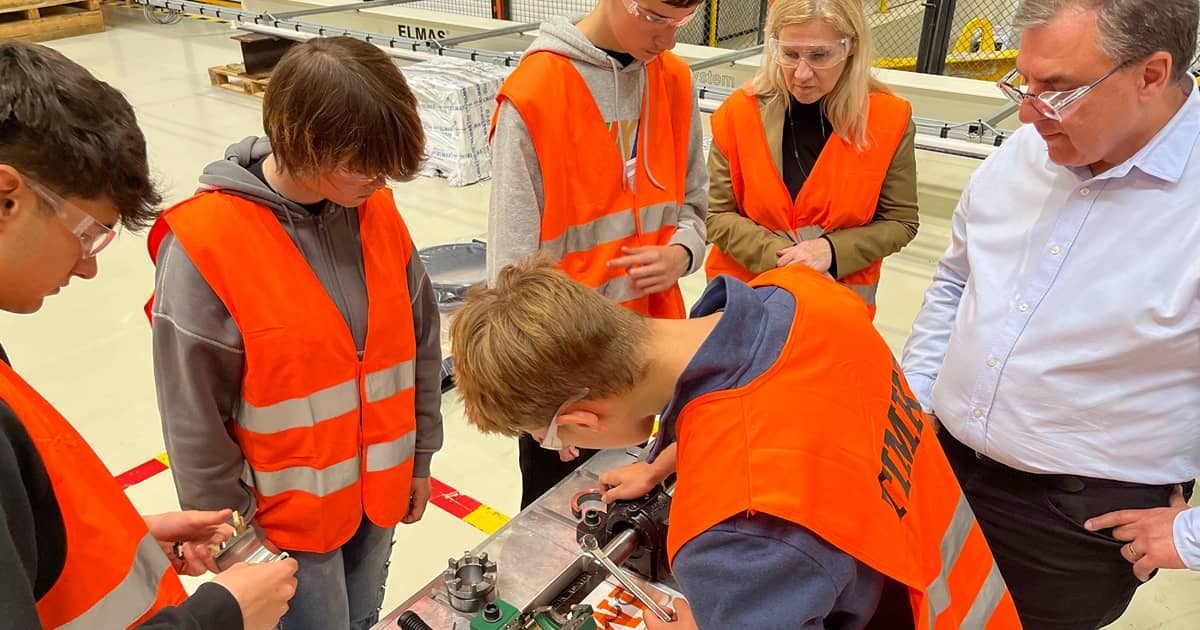 Students visiting Timken’s Ploiesti, Romania, facility during a hosted Career Day program reassemble a bearing demo rig after watching as it’s disassembled.